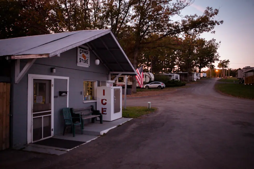 The Double G camp store with its ice chest beside the park road at dusk